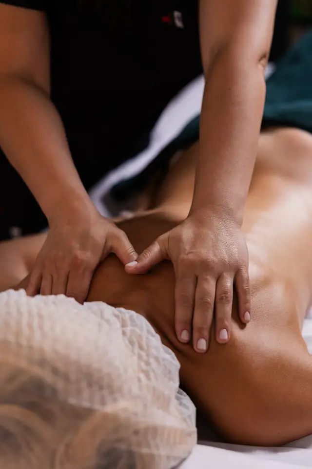Hands working along the body